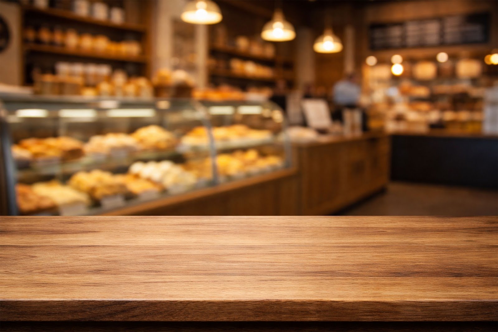 Wooden Table Mockup with Blurred Bakery Interior Background – Free Download HD