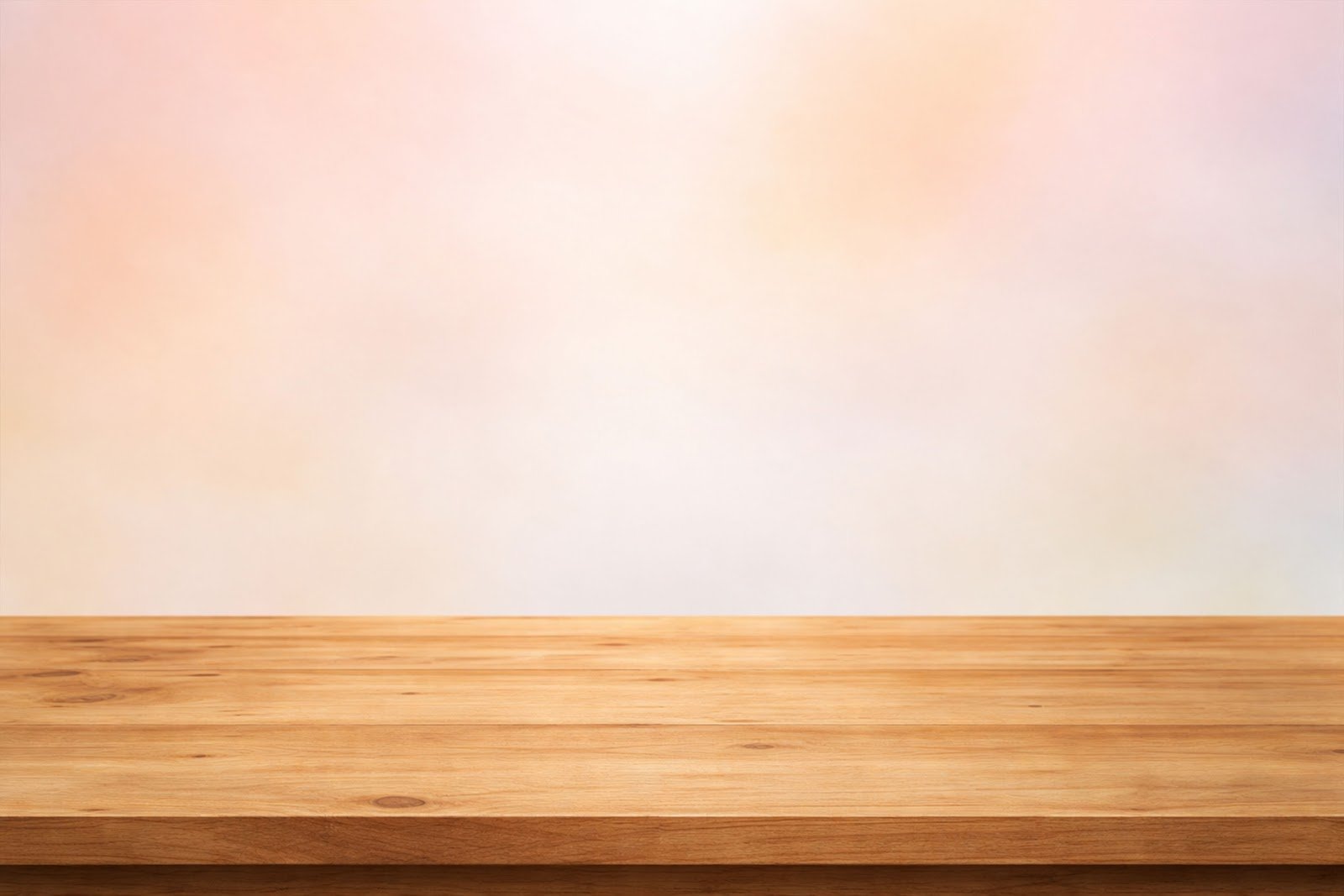Wooden Table Mockup with Soft Pastel Background (Warm Tones) – High-Resolution Download