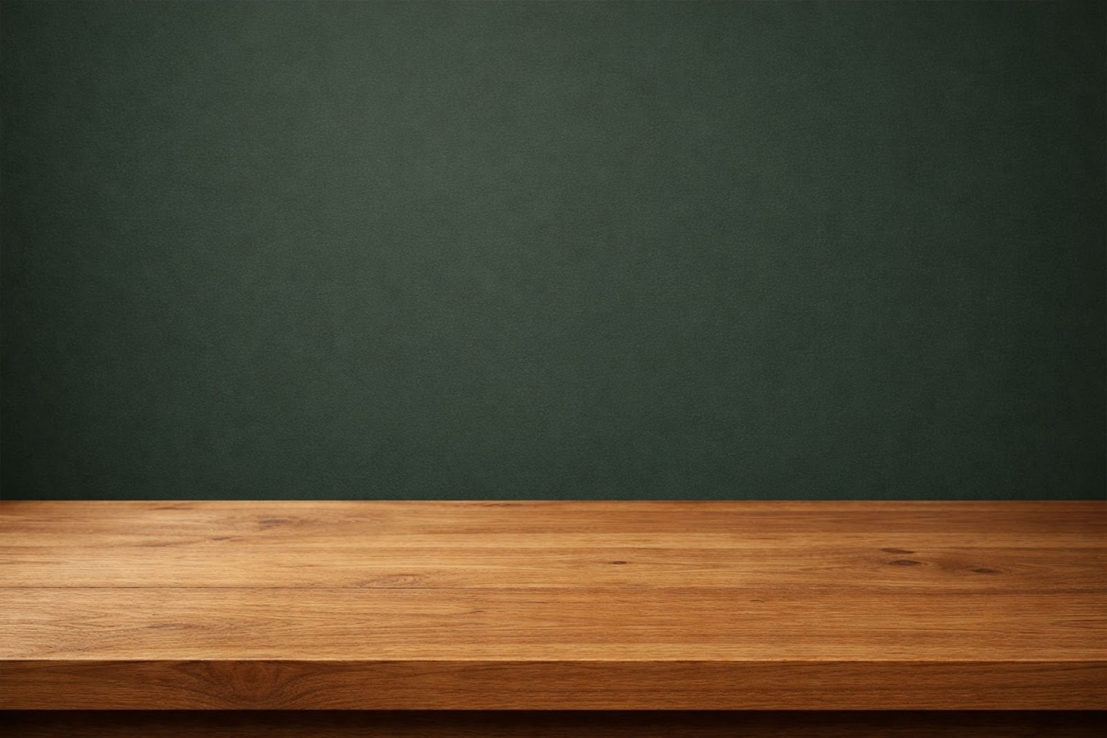 Wooden Table Mockup in Front of Dark Green Wall – High Resolution Download