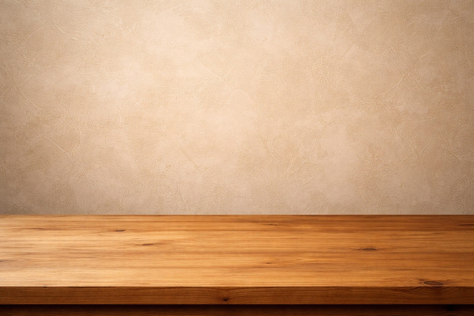 Wooden Table Mockup with Textured Plaster Wall Background – High-Resolution Product Display Download
